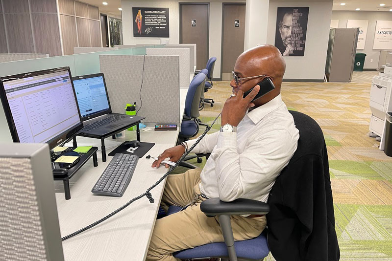 Progressive Dental Receptionist Taking A Phone Call