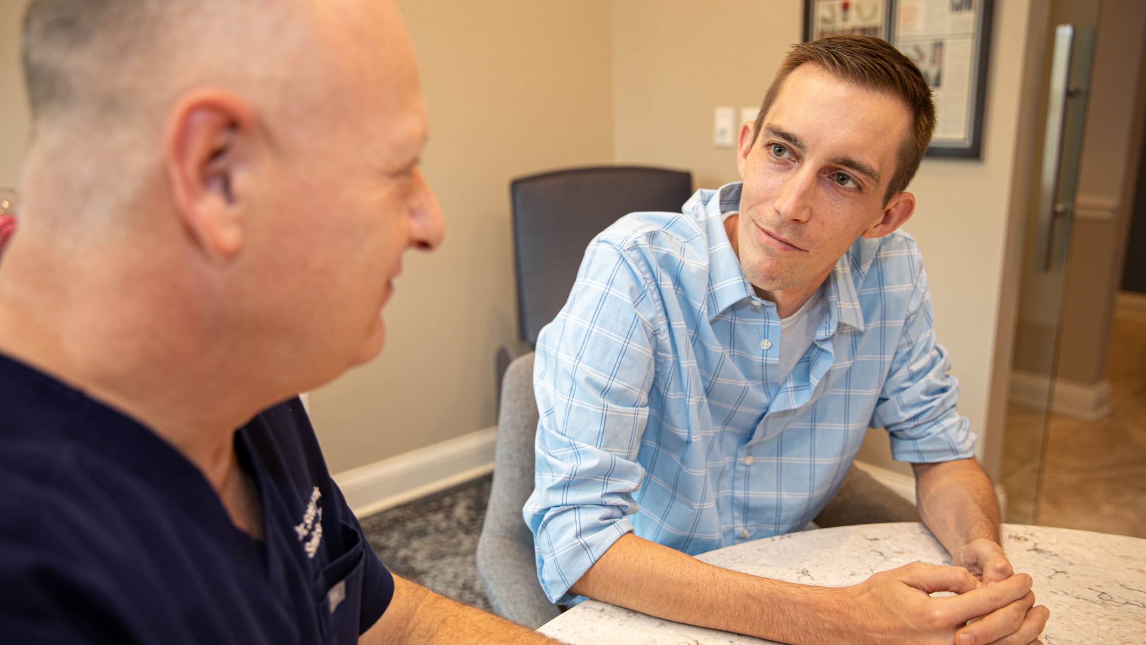 a dental professional discussing a dental procedure with a patient