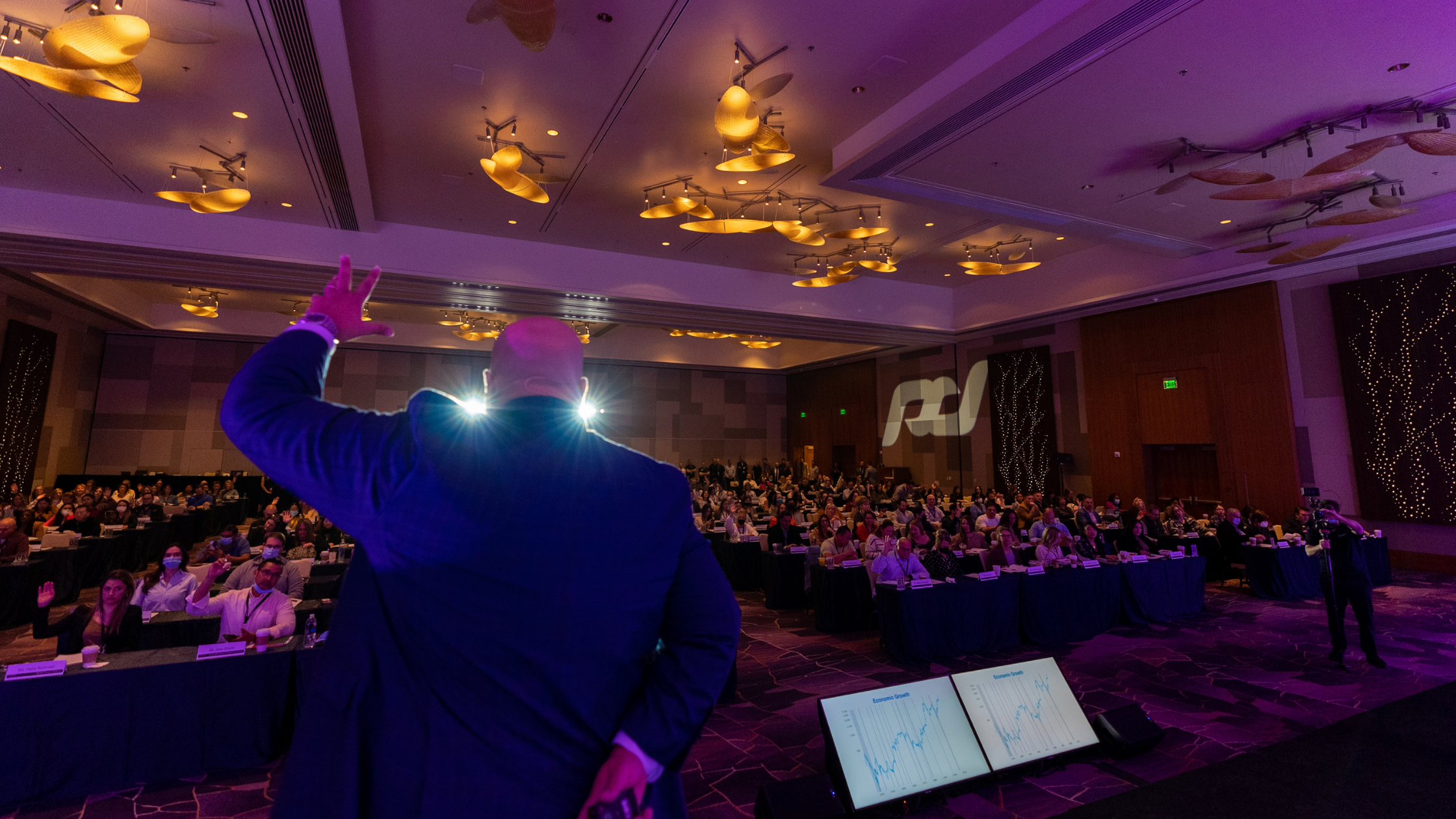 a packed room during a closing institute symposium